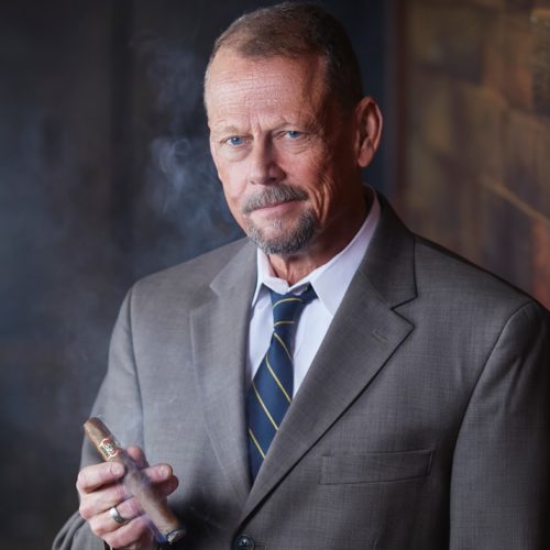David Witt holding Brick House Cigar IT Manager HeadShot