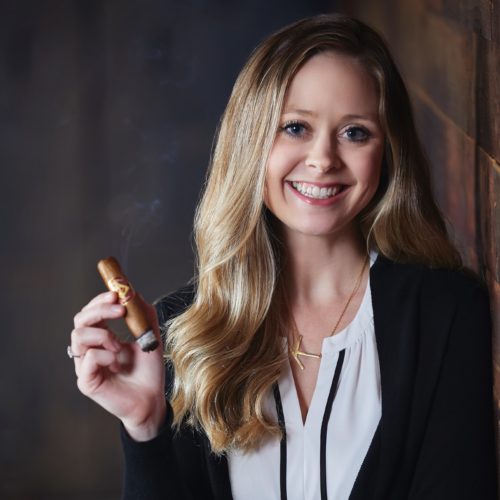 Kara Guagliardo Holding Diamond Crown. Marketing Director Headshot.
