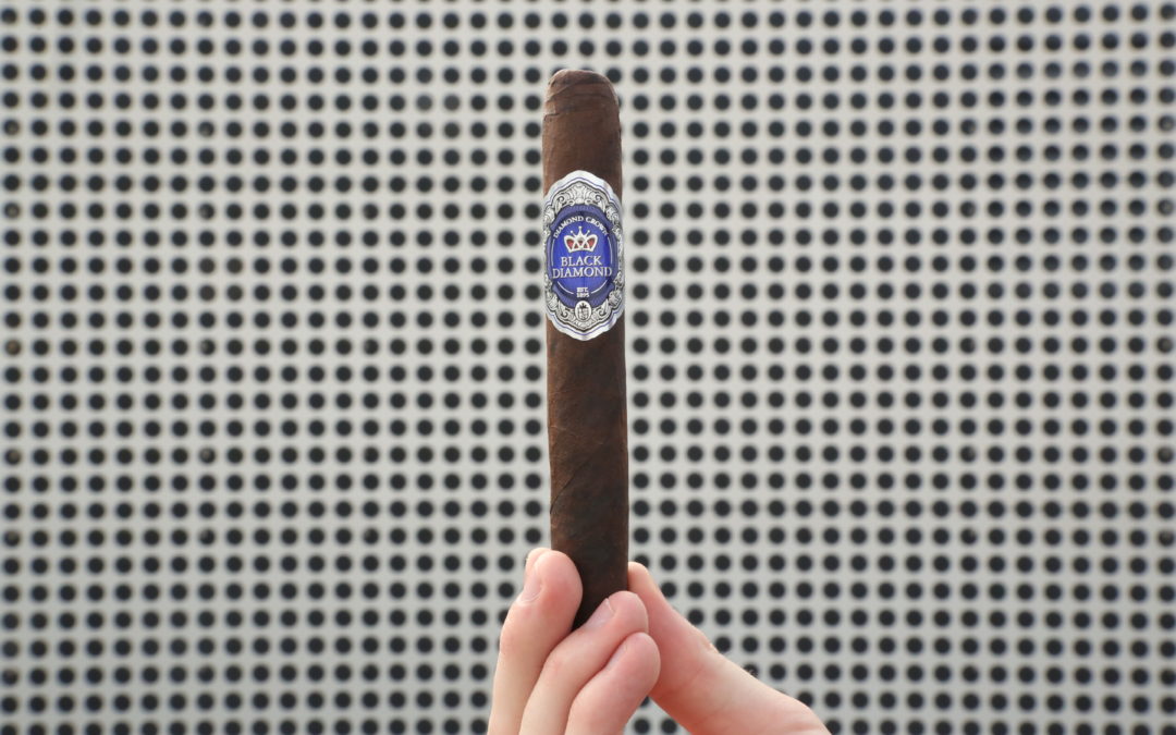 Black Diamond Cigar held at the foot