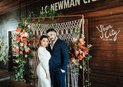 bride and groom in cigar handrolling factory tampa