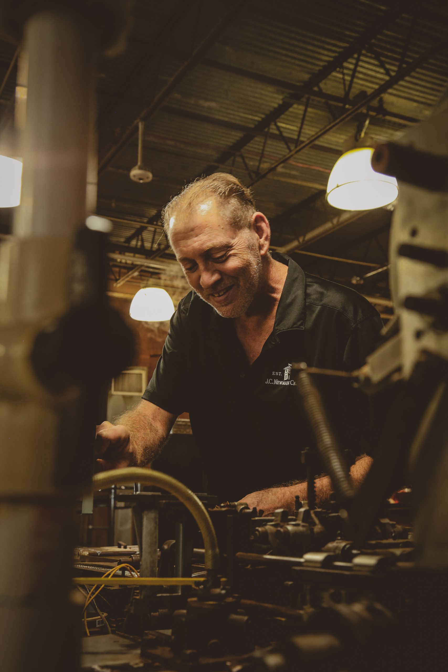 04 cigar mechanic working on 1910 cigar machine