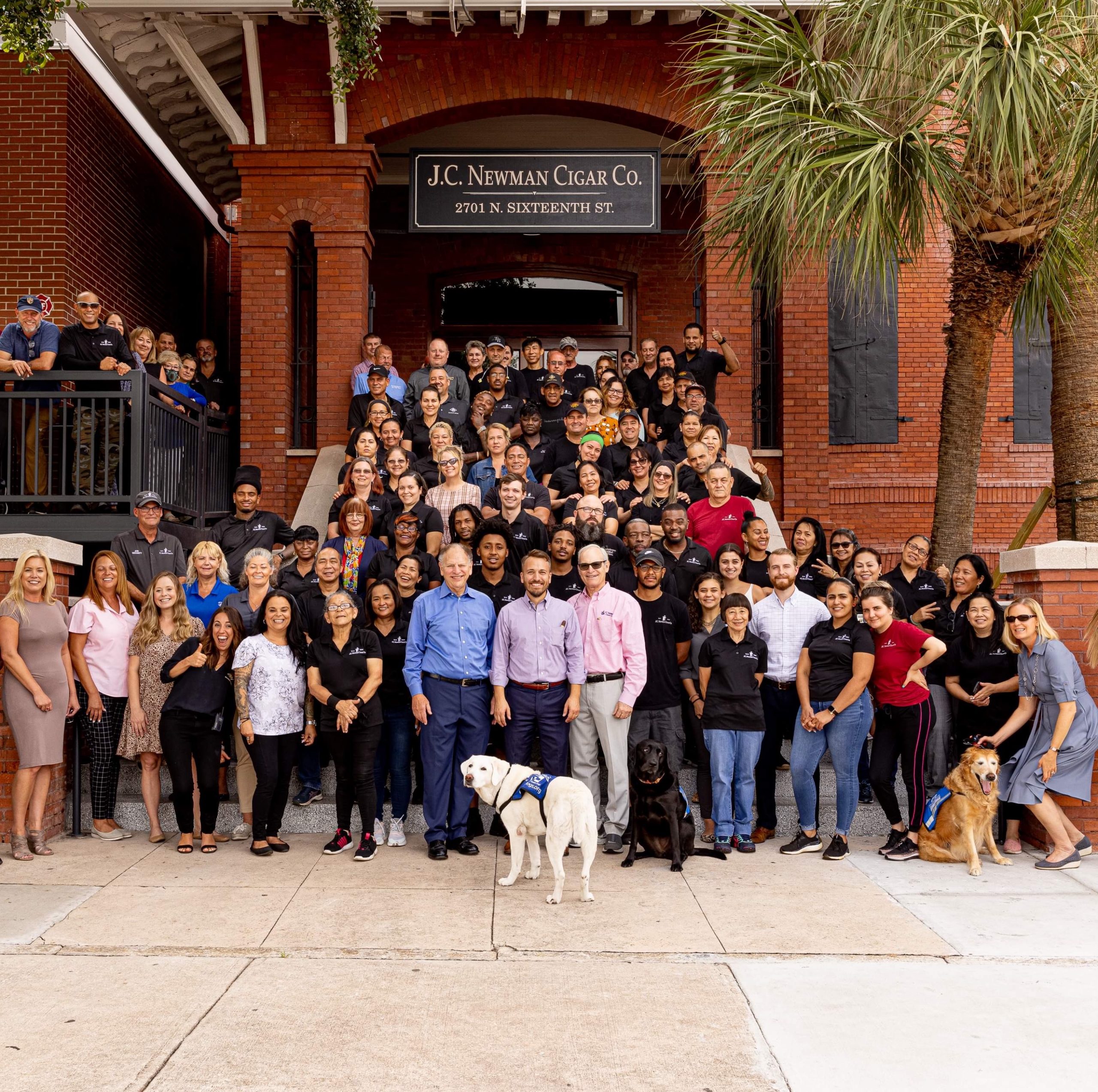 jc newman cigar company employee picture in front of el reloj cigar factory