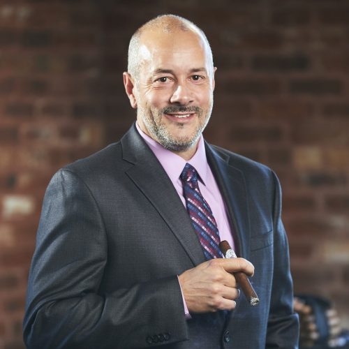 john oliva smoking julius caeser cigar headshot cigar sales rep