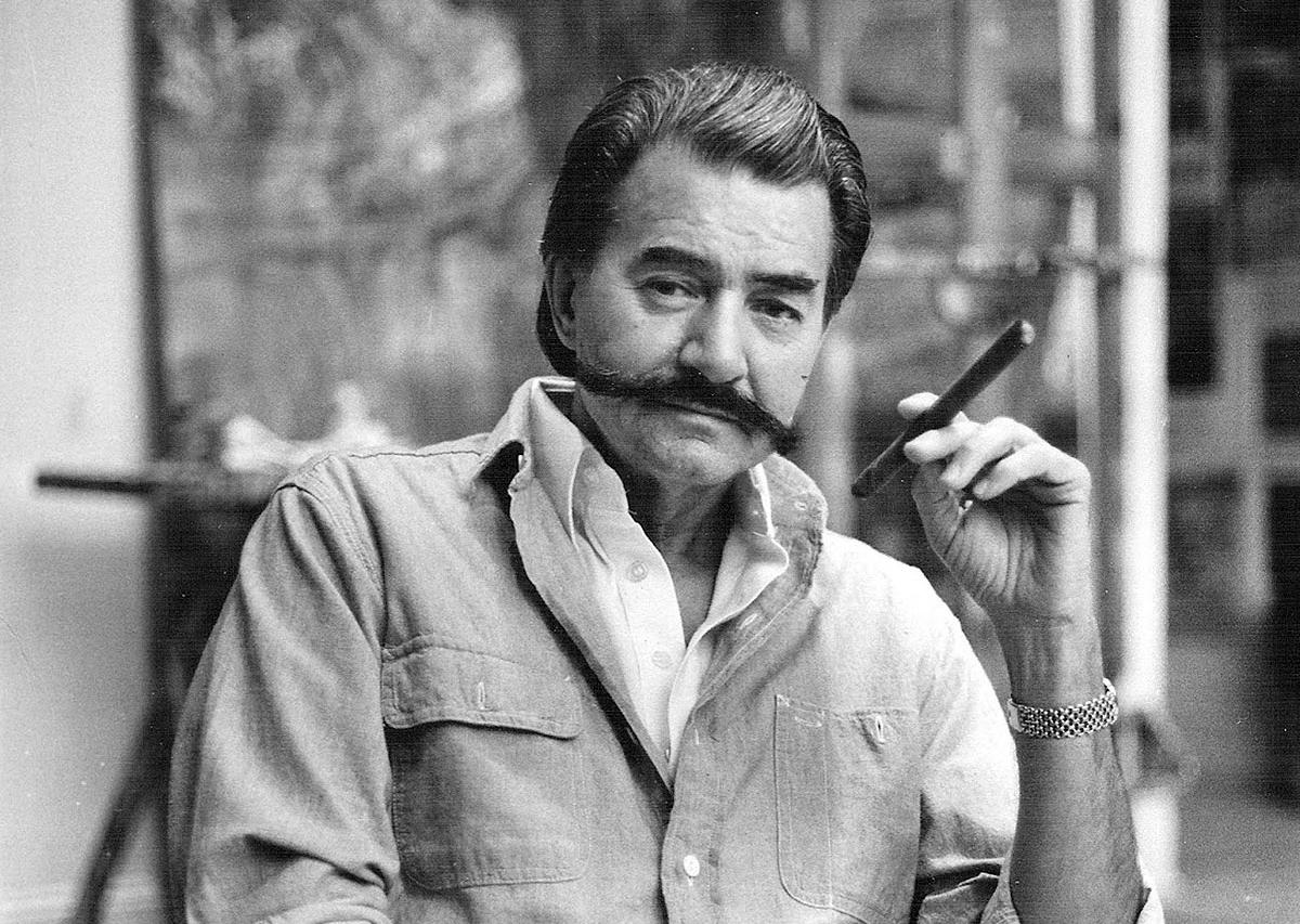 leroy neiman posing with a cigar