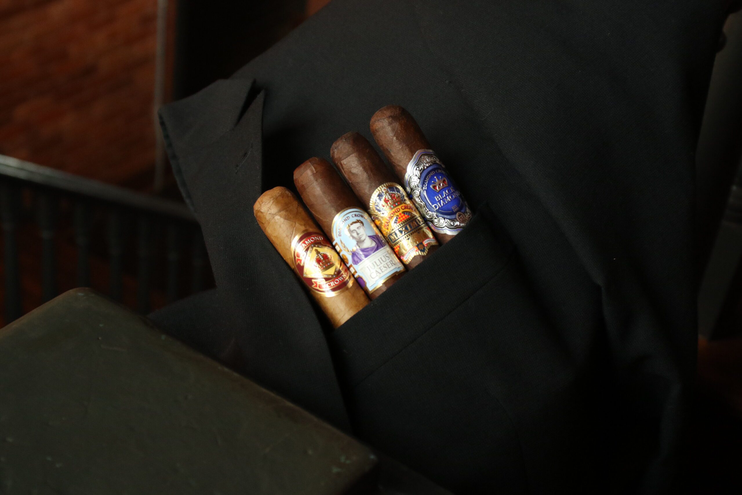 the diamond crown family of cigars in a jacket pocket