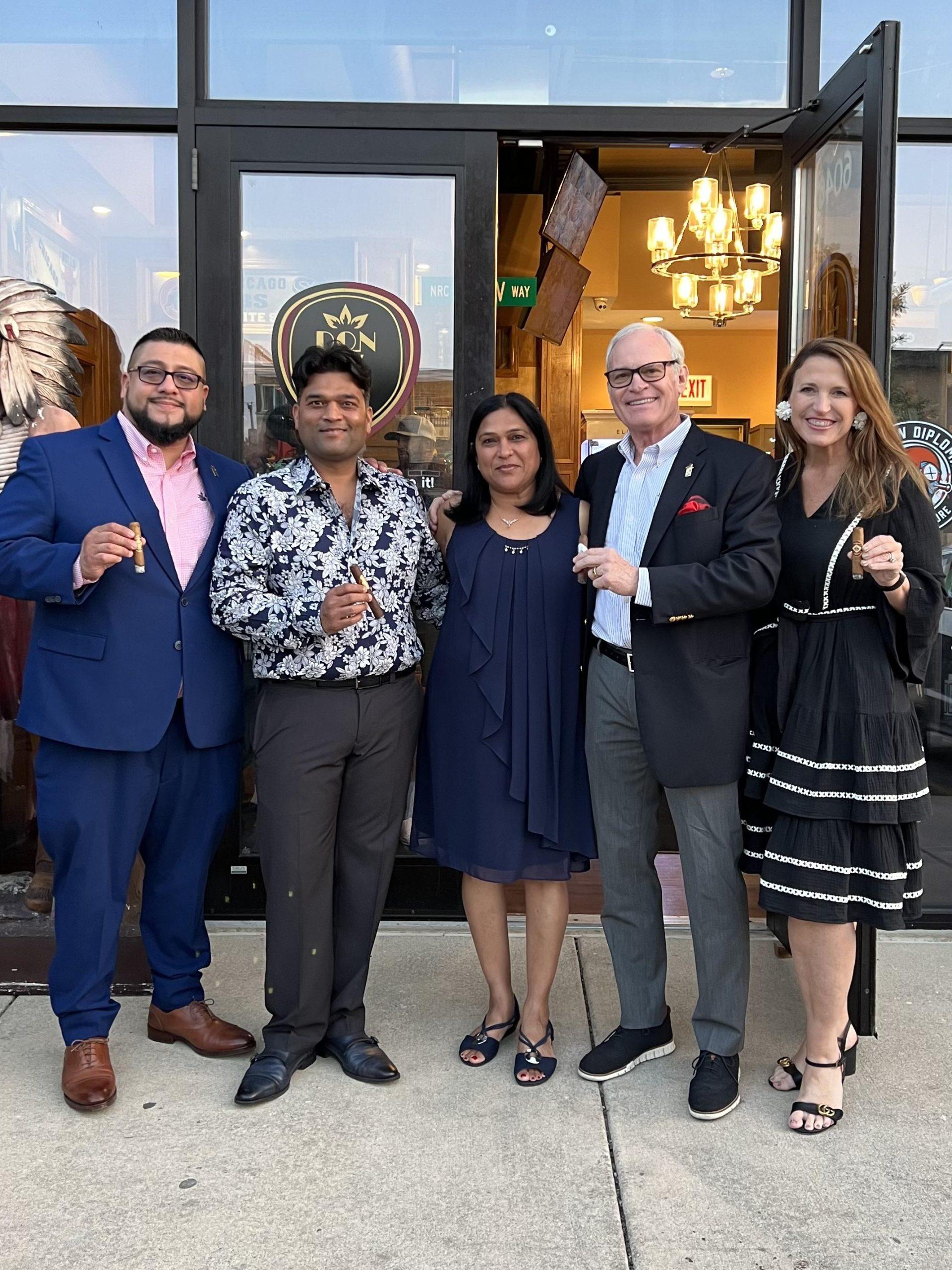 Bobby Newman with owners of Norwood Royal Cigar Lounge