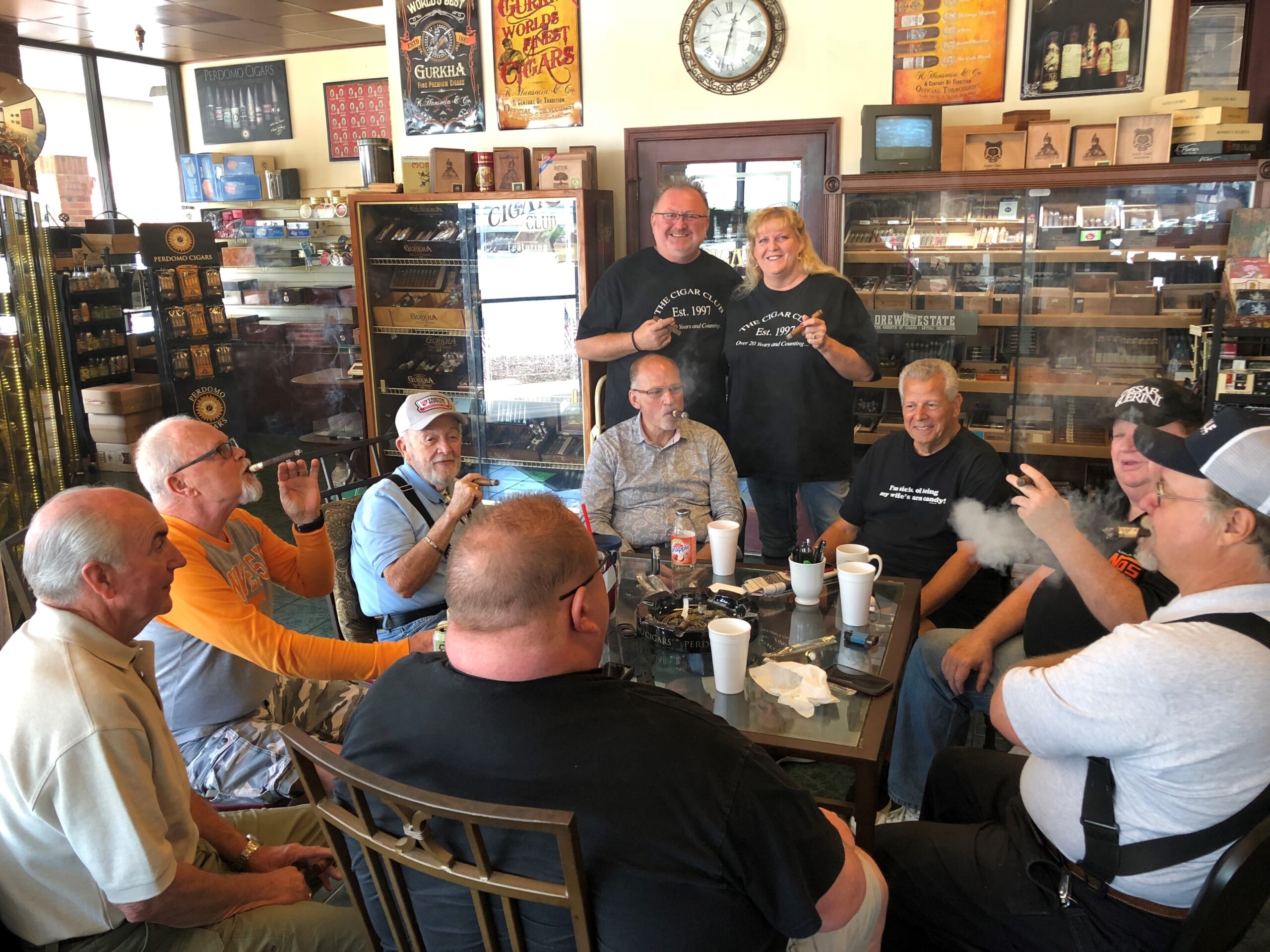 The Cigar Club owners inside their cigar shop